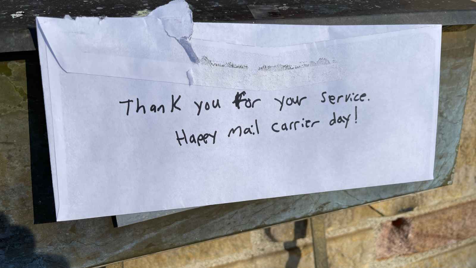 Thank you To A Mail Carrier on the back of an envelope