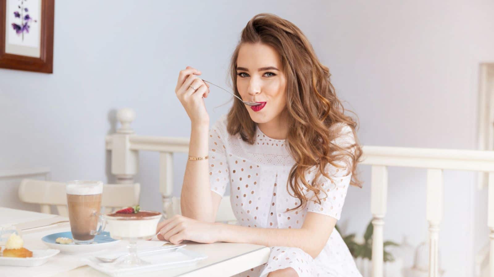 Woman Smiling Eating Alone